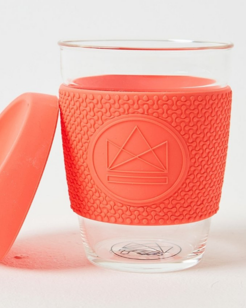Zero waste coffee cup essential for your sustainable kitchen. Orange and made with glas