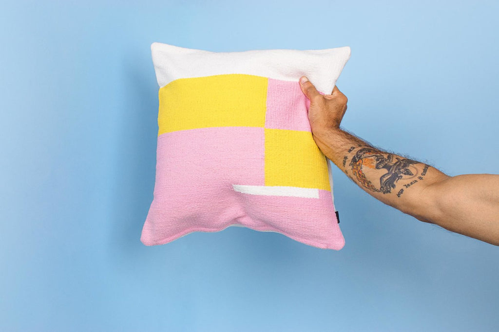 pink and yellow square cushion